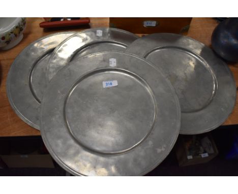 Four large vintage pewter dinner plates, possibly French.