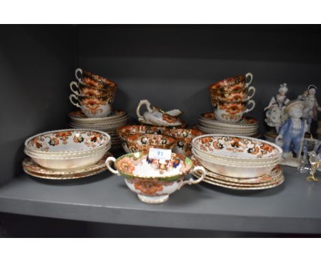 A part tea service in a gilt and Imari design stamped PR to base Prussia