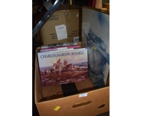 A selection of wild west and native American literature and reference books including a poster print of John Wayne