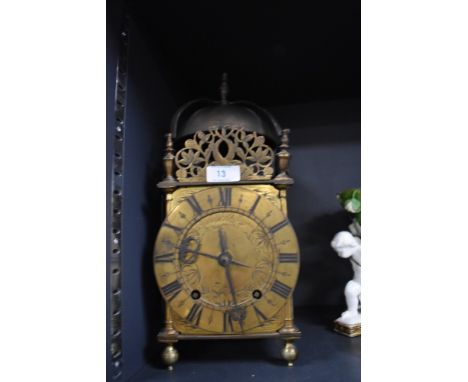 An antique lantern clock standing 36cm tall approx bearing name Richard Washington of Kendall / Kendal
Having a break to fine