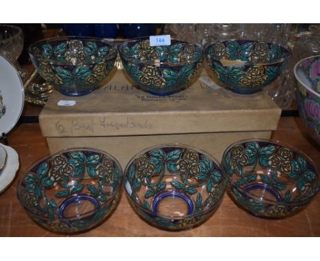 Three arts and crafts Rennie Mackintosh styled enamel glass bowls having blue borders with floral decoration plus three AF
pl