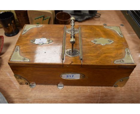 A vintage oak caddy or box having two lidded compartments with handle to centre.