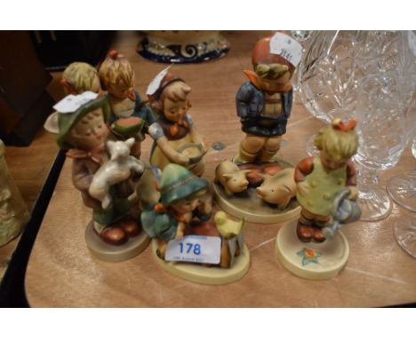 Six figure studies by Goebel including watering can girl, boy with pigs and boy holding lamb
