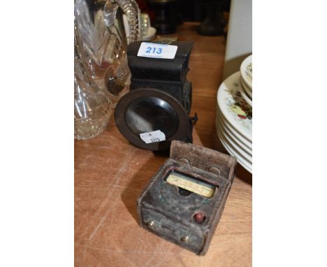 A lucas bike lamp and vintage light meter.
