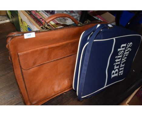 A vintage 1980's British Airways carry bag and a similar tan leather satchel