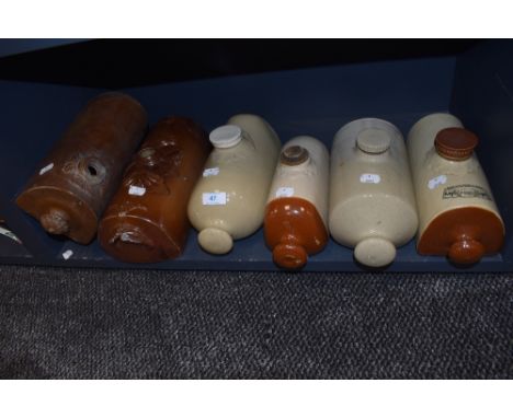 Six earthen ware ceramic foot warmers