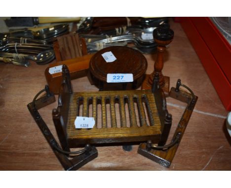 A collection of vintage wooden dolls house furniture.
