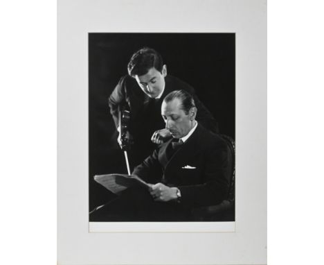 Likely a reprint - A black and white silver gelatine photographic print of two musicians, mounted, 38cm x 28cm.This artwork i