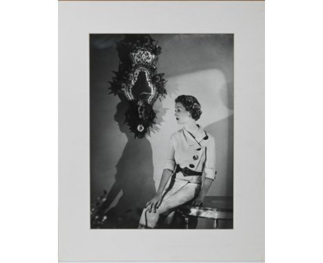Likely a reprint -&nbsp;A black and white silver gelatine photographic print, portrait of a seated woman, mounted, 38cm x 28c
