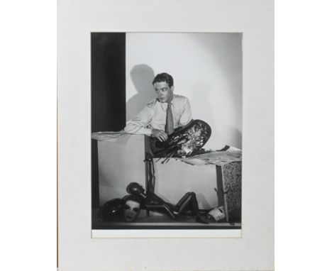Likely a reprint - A black and white silver gelatine photographic print of a young man with a painters palette and various dr