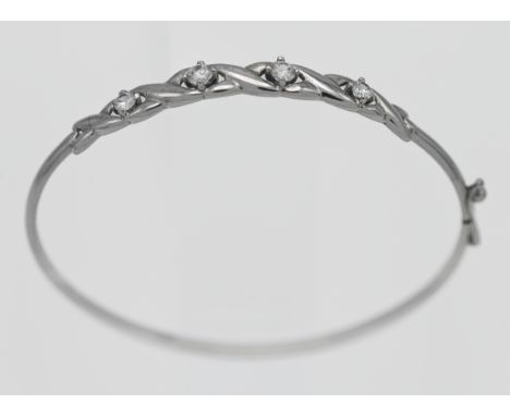 A 9ct white gold and white stone bangle, approx. 4.7g.