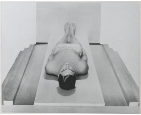 Likely a reprint -&nbsp;A silver gelatine photographic print, black and white image of a man laying on his back, 49cm x 39cm.