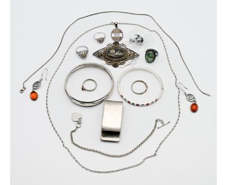 A mixed collection to include silver bangle, silver and amber earrings, silver rings. etc.
