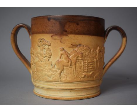A Large Stoneware Two Handled Loving Mug Decorated in Relief with Hunting Scene, 15.5cm high 