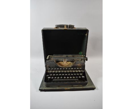 A Vintage Olympia Simplex Manual Portable Typewriter in Case 