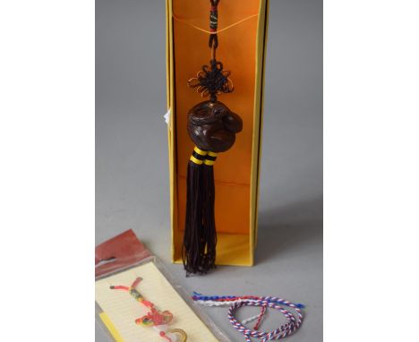 An Oriental Boxed Carved Wooden Netsuke on Rope Together with a Monkey Example 