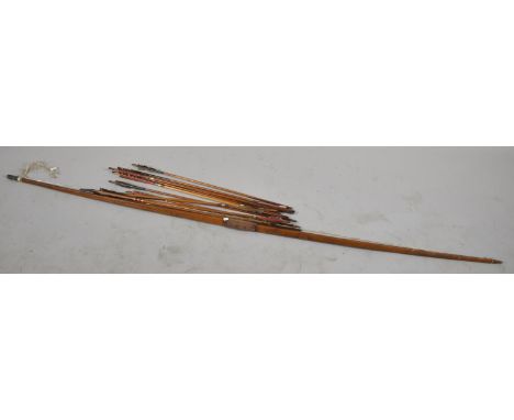 A Vintage Yew Wood Longbow and Collection of Twelve Arrow with Feather Flights 