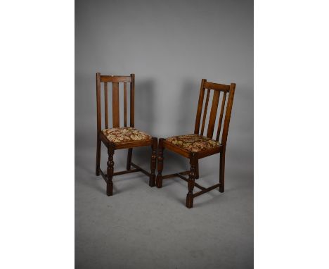 A Pair of Edwardian Oak Framed Dining Chairs with Tapestry Pad Seats 