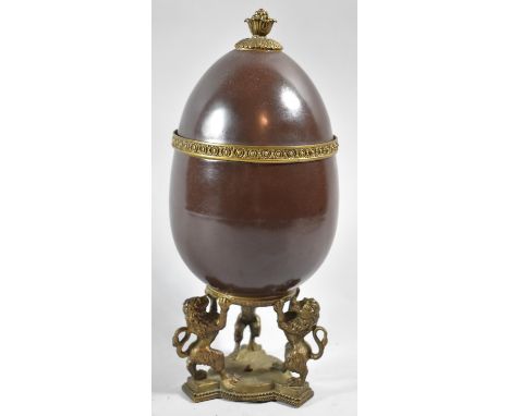 A French Ovoid Ceramic Ormolu Mounted Lidded Vase on Tripod Support in the Form of Three Rampant Lions, Pineapple Finial, 30.