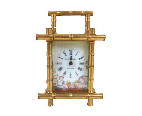A miniature brass faux bamboo carriage clock with decorative panels 7cm by 5.5cm by 11cm tall with key.in running order. 