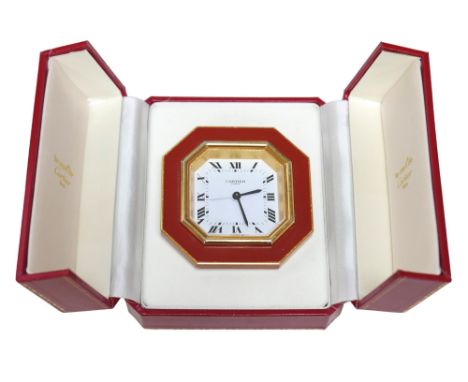 A Cartier Must de travel clock, with octagonal case, with alarm, 7.5 by 7.5cm, together with its original Cartier case, a/f.C