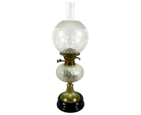 A Victorian paraffin lamp, with etched glass globe shade and clear glass chimney, 17 by 58cm high.