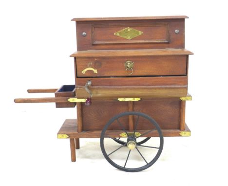 A miniature Victorian style street musical organ grinder, with brass fittings, and extra musical dics, in working order, 58.5