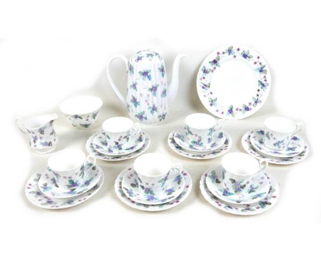 A modern hand painted bone china tea set, decorated with purple flowers and leaves, each signed 'Hand painted bone china by M