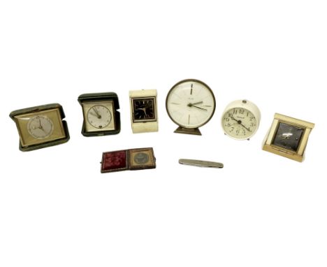 A group of six vintage travel clocks, comprising a Kienzle, Andrew De Luxe, Looping, and  Seth Thomas, a Mauthe desk clock, a