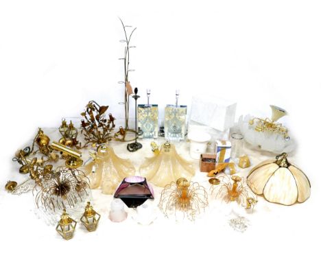 A large collection of lights and lighting, including ceiling pendant lights, a pair of table lamps, a tea light holder, and c