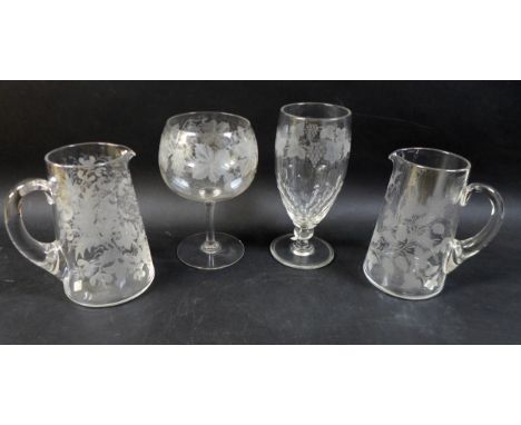 A group of four clear glass 19th century presentation vases / goblets, comprising one tall clear goblet engraved with frapes 