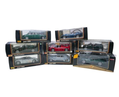 Eight Maisto 1:18 scale special edition die-cast model cars, including a 'Premier Edition Aston Martin DB7 Vantage', and a Ci