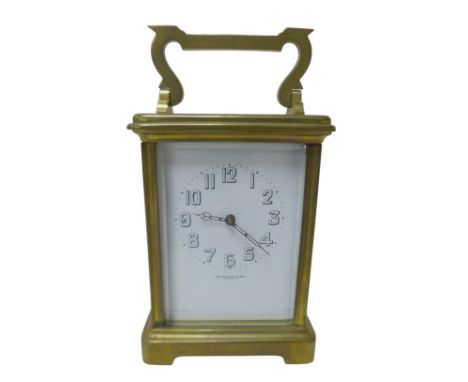 A small brass carriage clock by JAS Ritchie & Son of Edinburgh, with Arabic numeral dial, with key, 8 by 6.5 by 15cm high. 