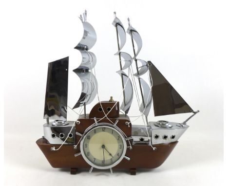 An Art Deco Chrome and wood three mast sailing ship clock lamp, 45 by 44cm, with electric Metamec movement.Not tested for wor