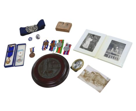 A WWI death plaque, named 'George Dick Martindale' with wooden mount,  and other militaria including four WWII medals: France