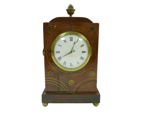 A Regency cased mahogany mantel clock, with brass inlays, ormolu mounts, Roman numeral dial, later movement, raised upon four