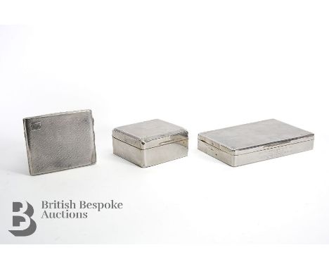 Silver cigarette boxes, including a small square example with engine-turned lid, Birmingham hallmark dated 1930 mm William Ne