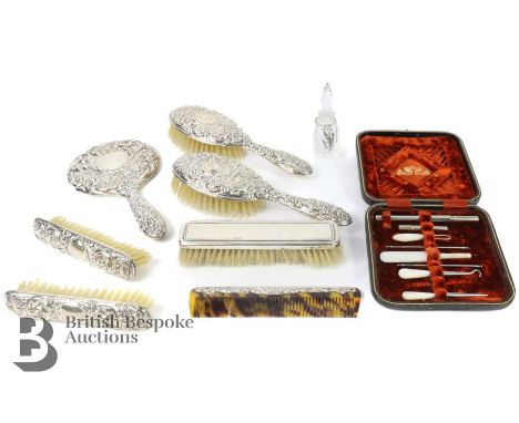 Elizabeth II silver vanity set, comprising two hairbrushes, hand mirror, clothes brushes, comb and a glass scent bottle, Birm