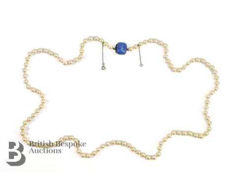 A string of cultured pearls, 78 cms, each pearl approx 6mm, 109 pearls, on a 9ct gold, silver and blue stone clasp stamped Sy