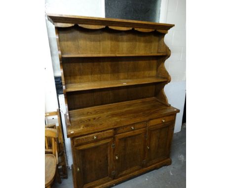 A 20th Century Oak Cottage Style Dresser With Two Shelf Rack