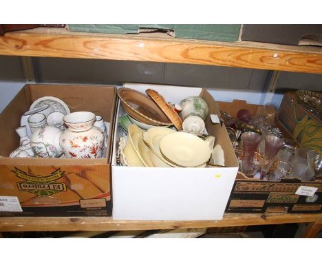 A shelf of glass and china ware