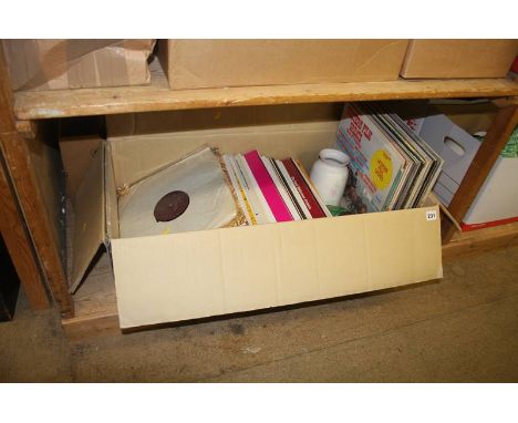 A shelf of assorted, records, books etc.