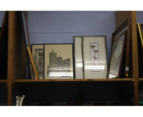 A shelf of pictures/ prints