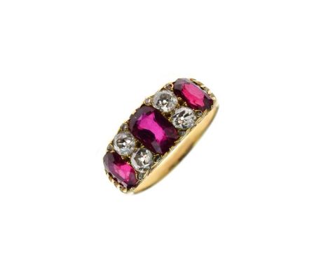Diamond and ruby ring, unmarked mount, the three graduated oval cuts with pairs of old brilliant cuts between and rose diamon