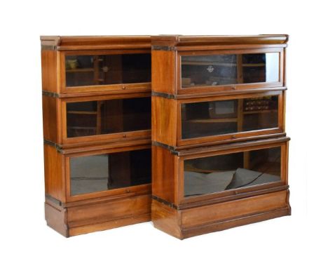 Pair of early 20th Century Globe Wernicke mahogany three tier sectional bookcases, each fitted up-and-over doors, 86.25cm wid