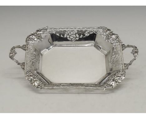 George VI silver fruit basket of rectangular form having cast grape vine handles and conforming pierced decoration to the rim