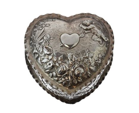 Victorian silver heart shaped box and cover having embossed decoration depicting Cupid piercing a heart with an arrow amongst