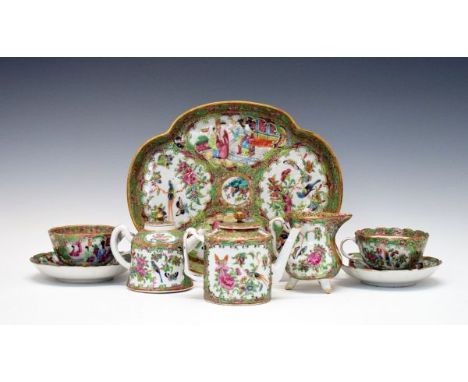 Matched Cantonese Famille Rose tea service, comprising: two tea pots, 10cm and 11cm high, two cups and saucers, cream jug, 10