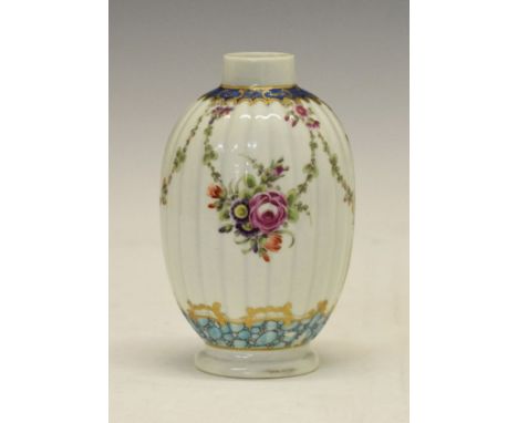 18th Century porcelain tea caddy of ovoid fluted form, decorated in the Worcester style with polychrome foliate swags, pale b