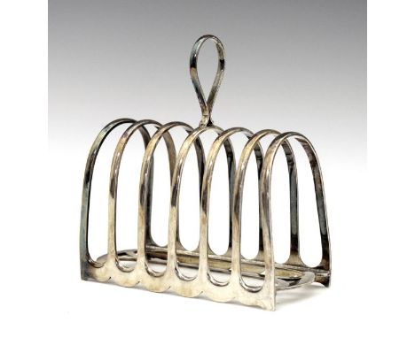 George V silver six division toast rack having a central loop handle, makers Atkin Brothers, Sheffield 1912, 13cm long, 10oz 